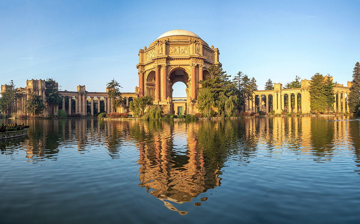 The Palace of Fine Arts in San Francisco, a large structure surrounded by a pleasant park.