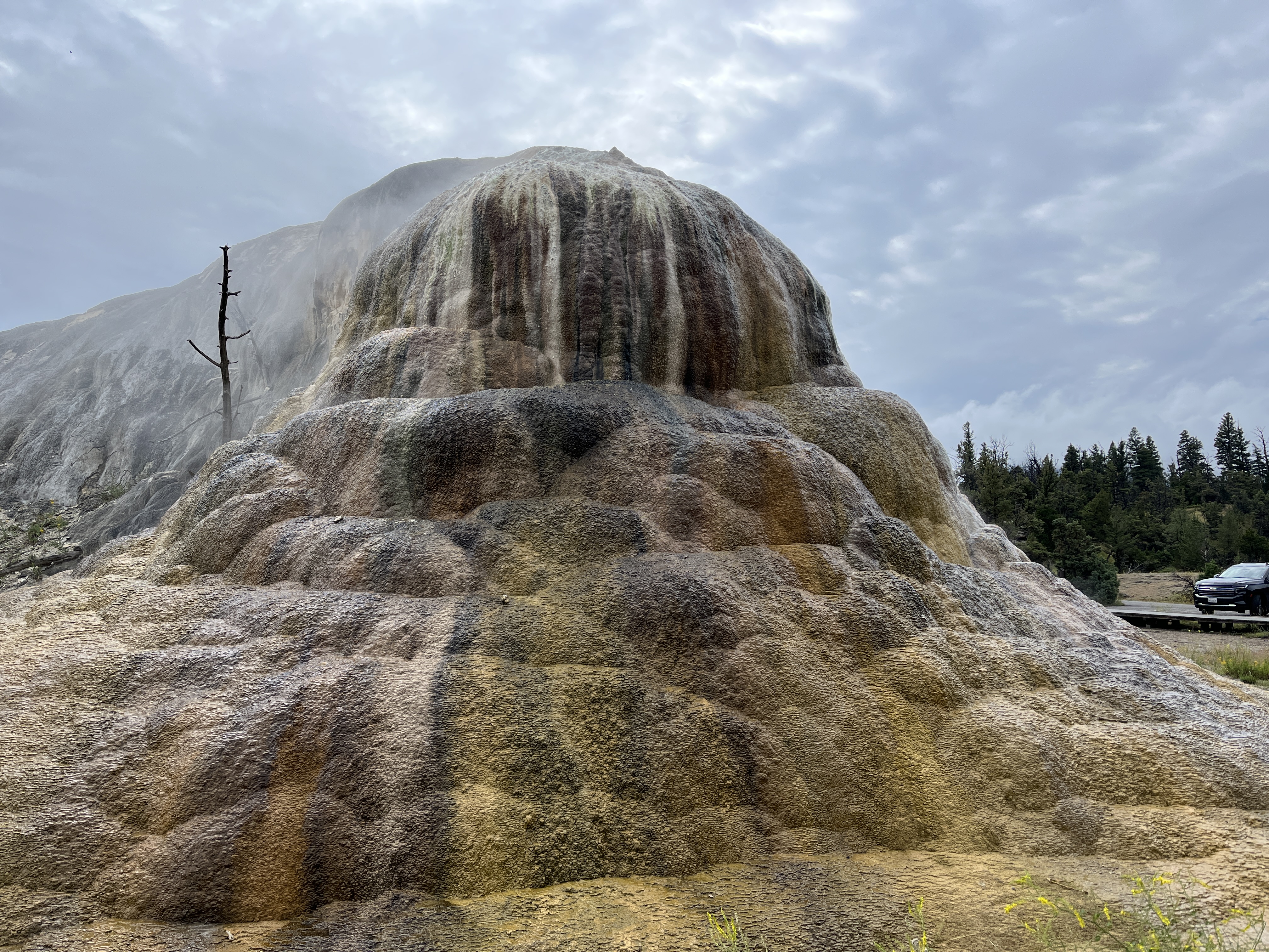 A large mound of multi-colored travertine.